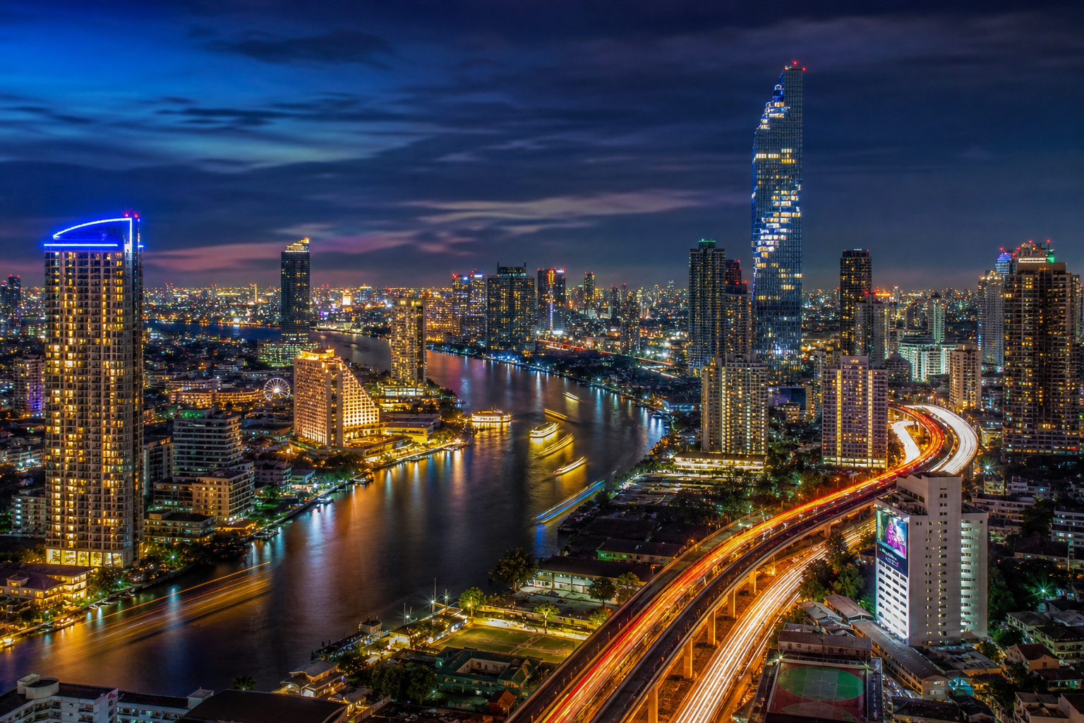 Bangkok skyline at night with illuminated skyscrapers and Chao Phraya river